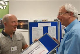Photo:Peter Hammond and David Dunford from West Bridgford & District LHS have a friendly tussle over who will put this part of their display up, or is it take down? Another stalwart supporter of Angel Row history fairs.