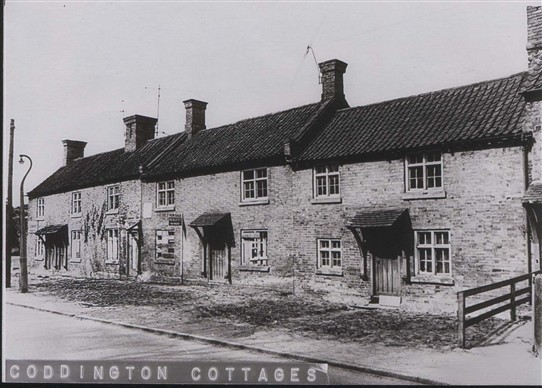 Photo:The cottage on the right, number 22, is believed to be the oldest because a bricked-up window can be seen on the internal west gable wall.
