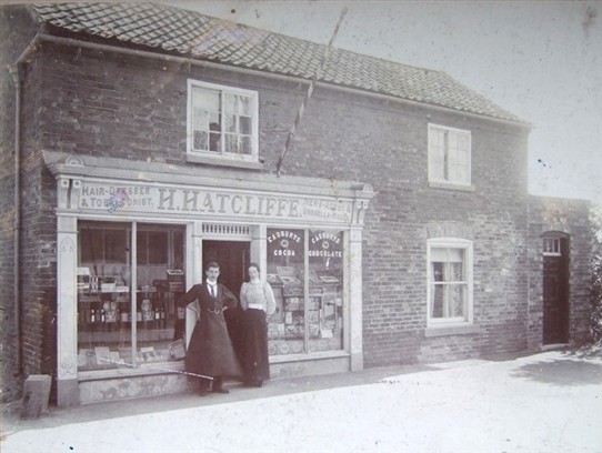Photo:Hatcliffe's hairdressing shop with very prominent barber's pole