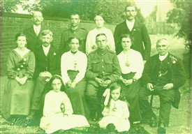 Photo:William Bell (centre, in uniform) came home from the trenches to attend this family wedding at Ordsall Church in August 1917