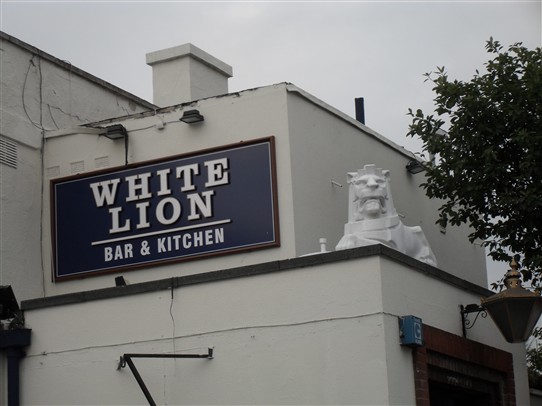 Photo:ABOVE; The Lion atop 'The White Lion' pub in Beeston