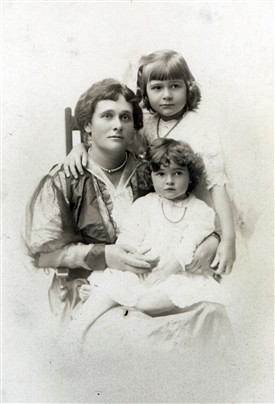 Photo:Tatiana with daughters Sonia (standing) and Tatiana (sitting on her mother's knee)